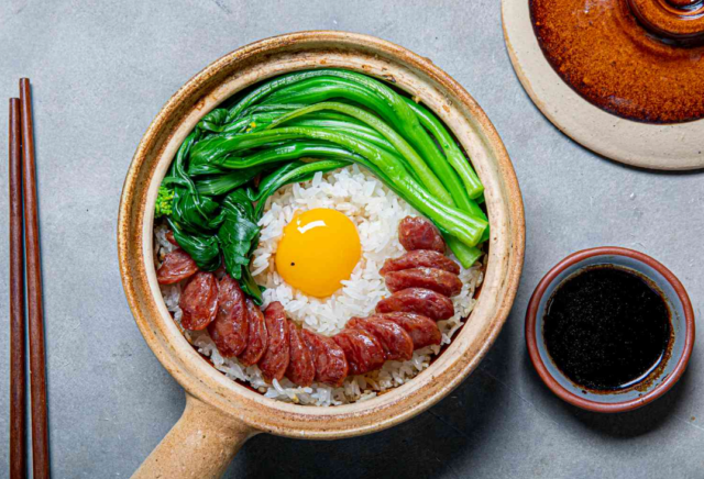 Claypot Rice, a traditional Cantonese dish, served with soy sauce