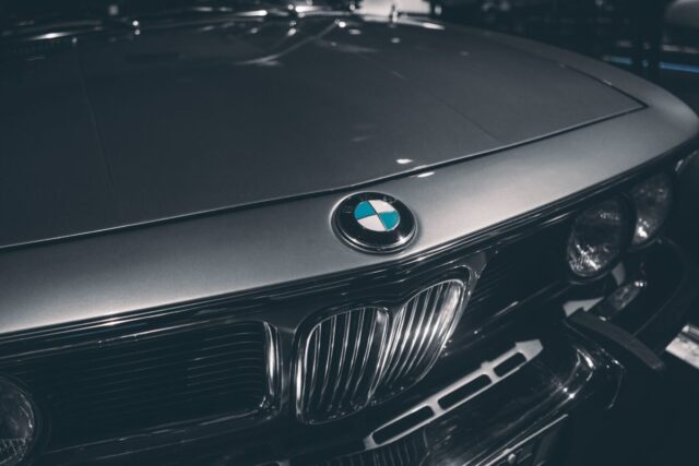 Close-up of a classic BMW hood emblem, captured in Munich, Germany