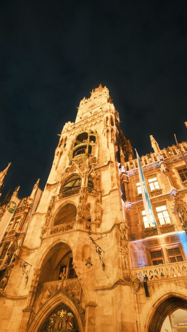 Munich's Gothic Revival New Town Hall illuminated at night on Marienplatz